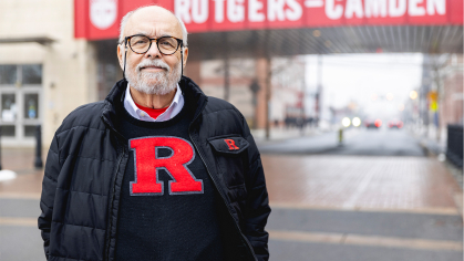 Cal Maradonna standing in front of a Rutgers Camden sign