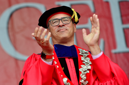 Rutgers President Holloway applauding graduates during 2022 Commencement