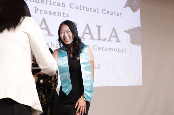 Student receiving the AACC stole on stage
