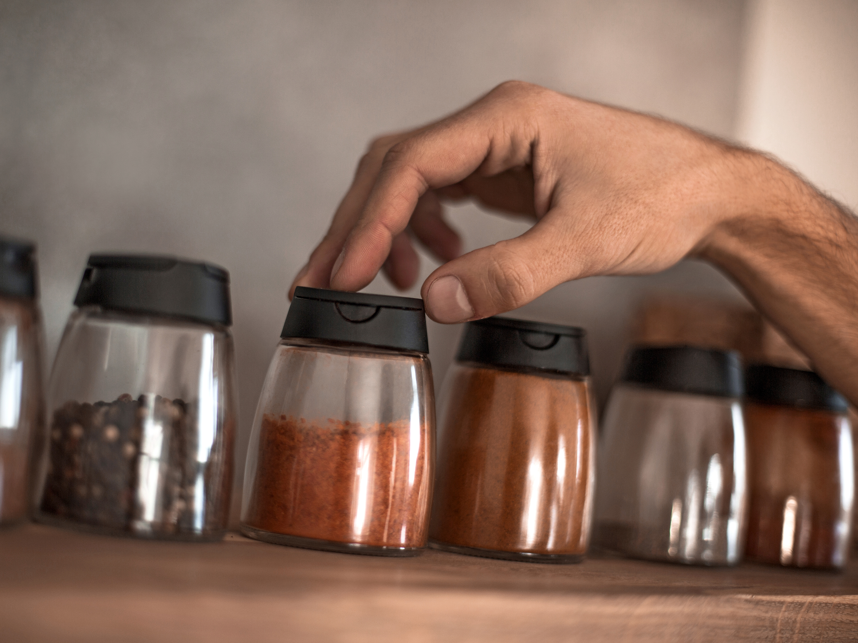 The Simple Reason Your Spice Jars Are Clumped Up