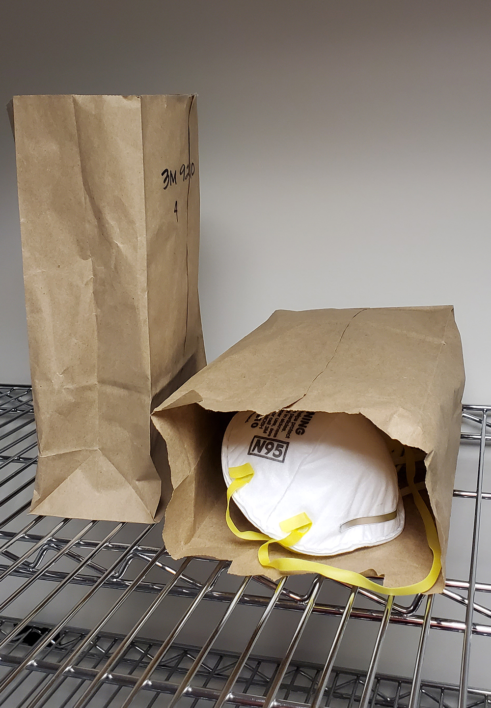 Decontaminated masks in individually labeled paper bags