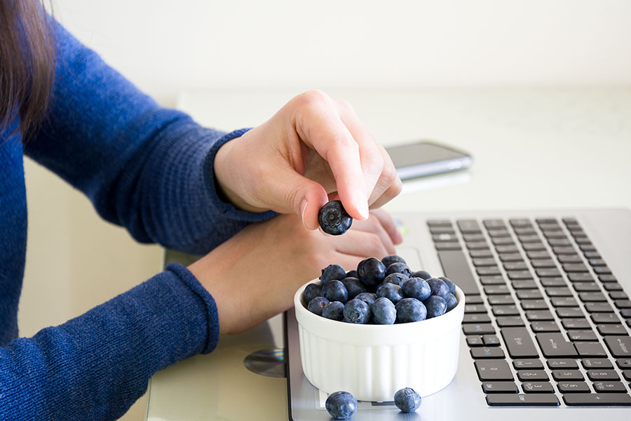Student eating berries