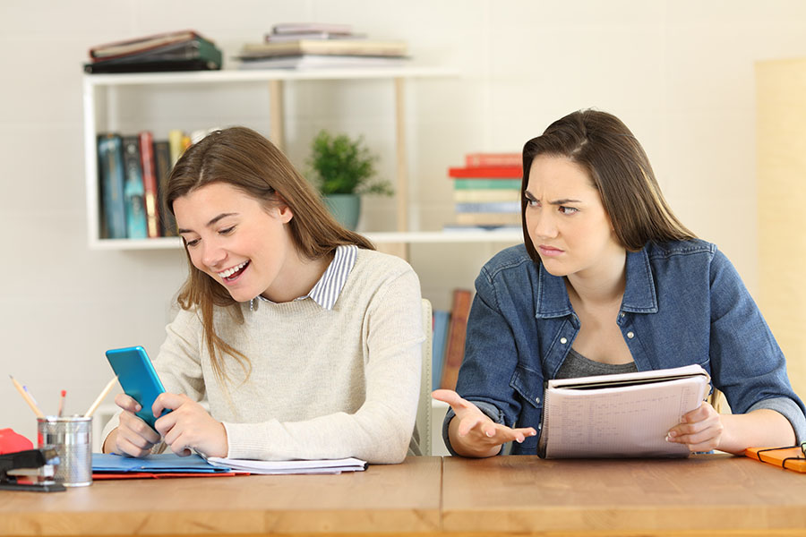 Student distracted by cellphone while studying