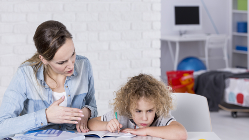 A mother trying to help child with homework