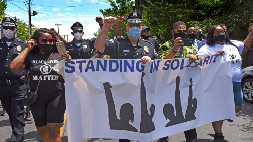 Joseph Wysocki (center), chief of the Camden County Police Departmentl, and fellow officers demonstrated peacefuly on May 30
