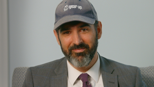 Brian Ballentine wearing a hat from his time in AmeriCorps