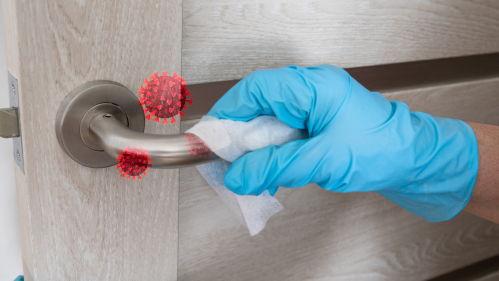 hand railing being cleaned by a gloved hand