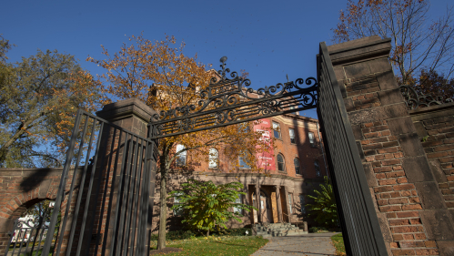 View of Winants Hall through the Class of 1882 gate on an autumn day.