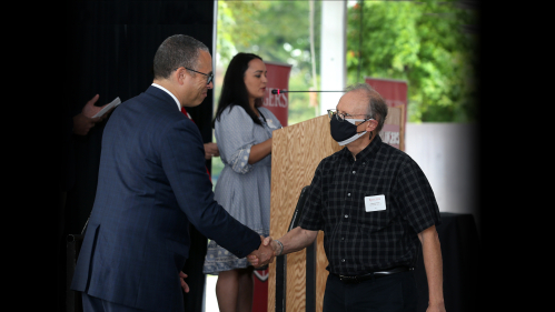 Longtime faculty ceremony President Holloway and Maurice Elias