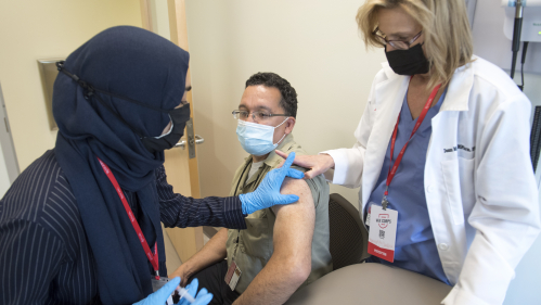 Employee receiving COVID-19 vaccine.