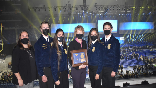 Laura Lawson, interim executive dean at Rutgers’ School of Environmental and Biological Sciences, accepts an Honorary American FFA Degree from the National FFA (Future Farmers of America).