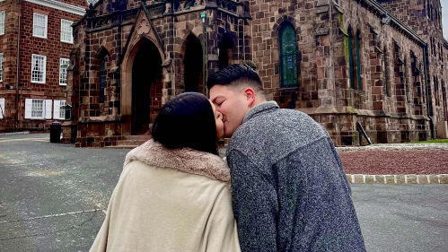 Alexandra Rodriguez and Salvatore Liguori kissing in front of Kirkpatrick Chapel