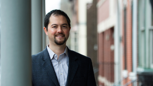 Assistant professor of criminal justice Nathan Link standing in the City of Camden