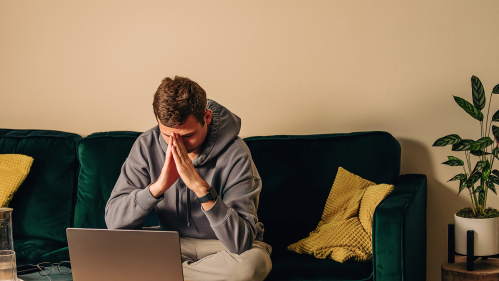 Man depressed on the computer