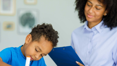 Psychologist with a student at school