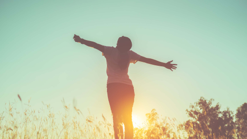 a happy woman enjoying fresh air
