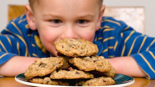 Child wanting to eat a cookie