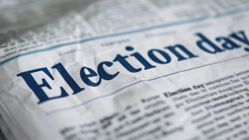 The headline of a newspaper reads "Election day."