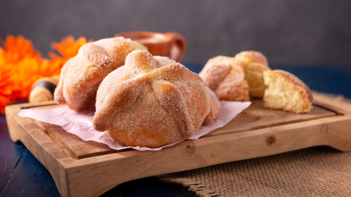 Pan de la muerte is a bread enjoyed by the living and used to honor the dead during Dia de los Muertos