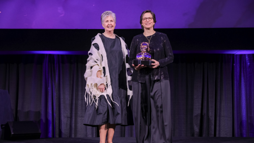 Dean Feldman, right, receives her award from Marsha Pyle, president of the American Dental Education Association’s Gies Foundation on a March 10 ceremony.