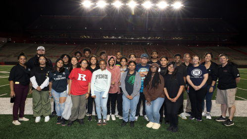 Members of the New Brunswick High School Marching Band visit the Marching Scarlet Knights