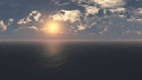 the ocean with a cloudy sun overhead