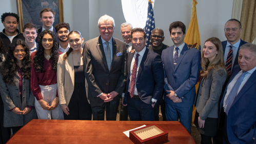 New Jersey Gov. Phil Murphy and Rutgers lecturer Elie Honig pose with Honig’s students from the Clemency Internship, former Governor Jim McGreevey and Rutgers President Jonathan Holloway after an event at Winants Hall to announce 87 pardons and six commutations on 4/8/25 in New Brunswick, N.J.