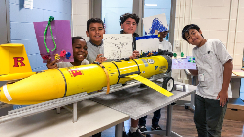 Students with a model of Rutgers Glider