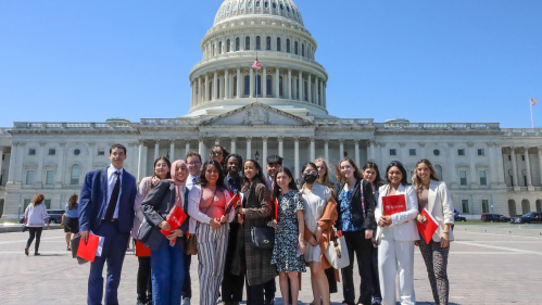 Rutgers students standing in front of the capital dome