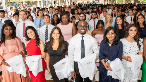 New Jersey Medical School Students Holding their White Coats