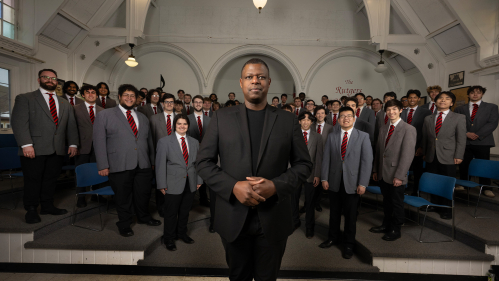 Director Brandon Williams with members of the Glee Club