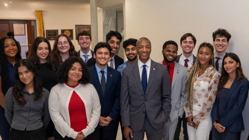 Rutgers president Tate with scarlet service internship students in Washington, D.C.