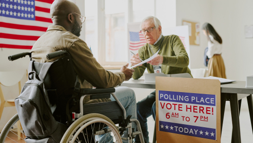 Person in wheelchair voting
