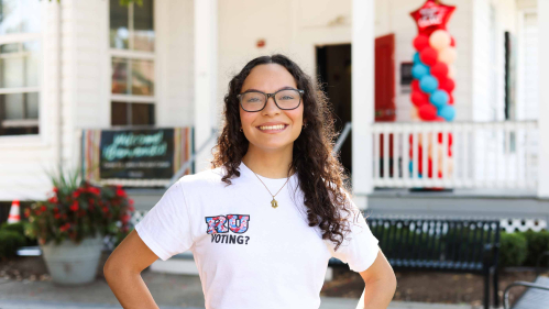 Alejandra Afanador, an RU Voting Ambassador, stands outside the Center for Latino Arts and Culture during a voter registration event on Sept. 22.