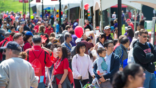 Visitors walk along Voorhees Mall on College Avenue campus during Rutgers Day.