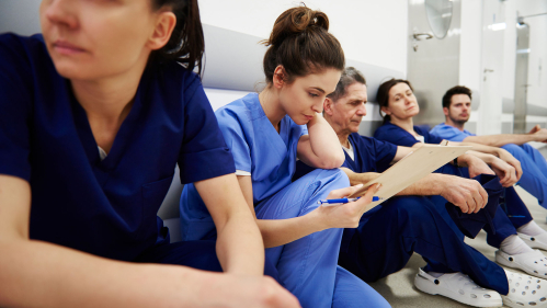 tired nurses in hall