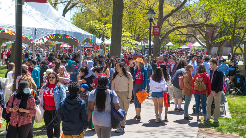 Throngs of visitors walk along Voorhees Mall on College Avenue during Rutgers Day 2022.