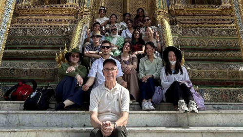 Rutgers professor Mark Robson (front) and his students pose for a group shot at the Grand Palace in Bangkok.