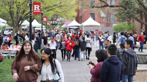 Students, faculty, alumni and community members walking around Voorhees Mall during Rutgers Day 2024.