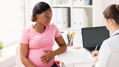 Pregnant woman with Doctor
