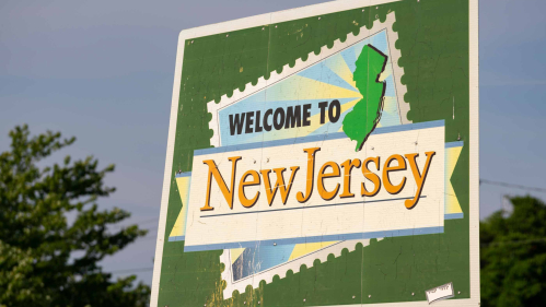 A highway sign reads, "Welcome to New Jersey."