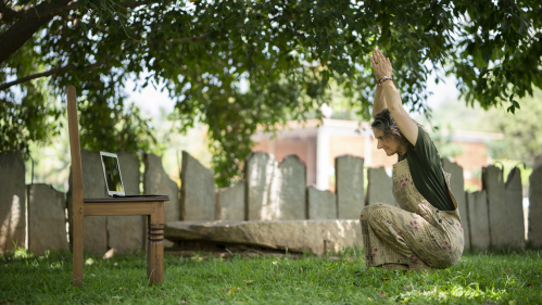 Woman participating in online yoga