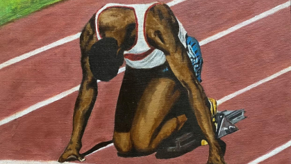 young Black person kneeling at starting line of a race