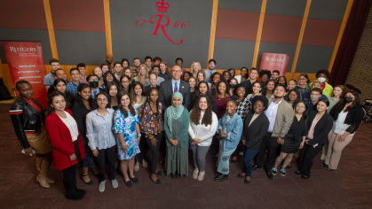 President Jonathan Holloway poses with students at the Rutgers Summer Service Institute launch event on May 19, 2022.