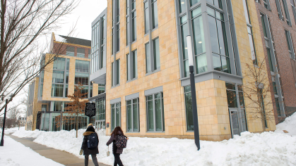 rutgers students walking on a snowy college avenue campus street