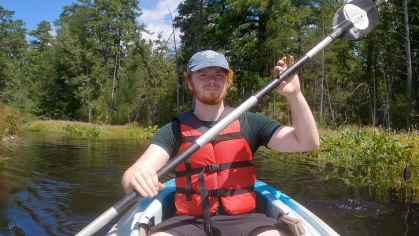 rutgers student rows kayak in new jersey pinelands