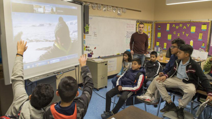 Kids in a classroom participating in ENIGMA program