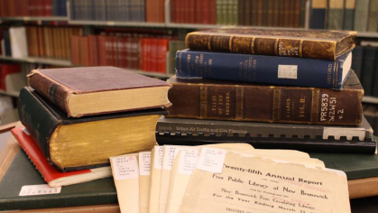 Pile of books and papers in a library 