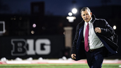 Greg Schiano in front of B1G sign