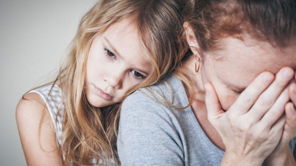 Child hugs upset family member